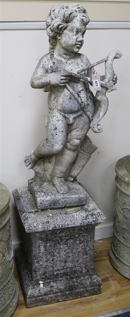 A weathered reconstituted stone garden figure of Cupid with bow and quiver of arrows, on square plinth W.40cm approx